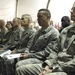 Brigadier General Steve Kwast, 455th Air Expeditionary Wing commander and Chief Master Sgt. Jeffrey Cui, 455th AEW command chief listen to Army Sgt. First Class Raleigh Sell, the protocol non-commissioned officer in charge from Combined Joint Task Force 8