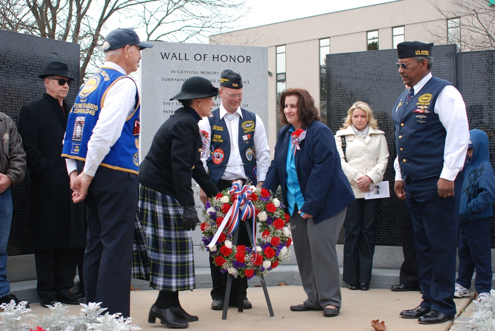 Allyn B. Donath and Sarah Baxter lay the wreath honoring all submariners who have been lost in service to their country in front of the Wall of Honor at the U.S. Submarine Veterans WWII National Submarine Memorial East in Groton. The submarine veterans' V