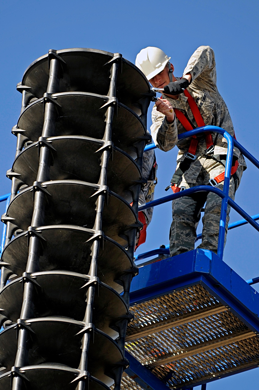 Ellsworth Airmen repair speakers