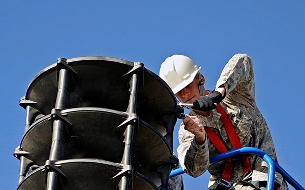 Ellsworth Airmen repair speakers