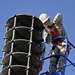 Ellsworth Airmen repair speakers