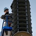 Ellsworth Airmen repair speakers