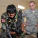 U.S. Airmen Unload Ammunition Skills on Iraqis