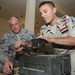 U.S. Airmen Unload Ammunition Skills on Iraqis