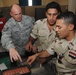 U.S. Airmen Unload Ammunition Skills on Iraqis