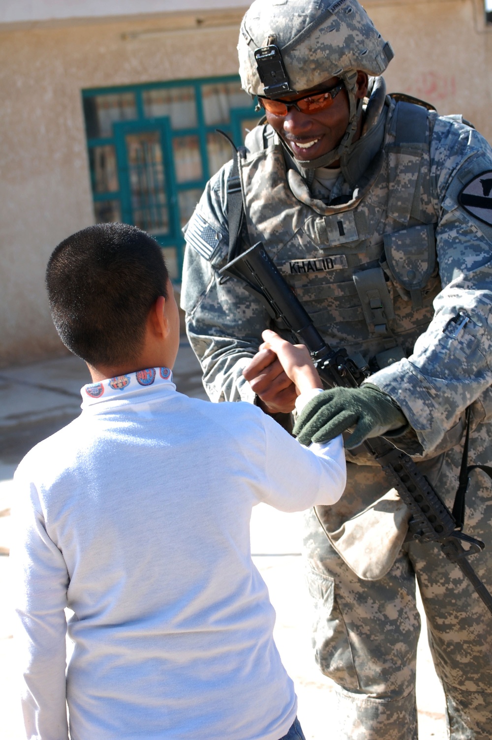 Cavalry troopers, Iraqi army visit local school; provide assistance