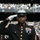 New York Jets Vs Jacksonville Jaguars Military Ceremony A United States Marine in dress blues uniform is rendering a salute at what appears to be an NFL game between the Jacksonville Jaguars and New York Jets, as indicated by the scoreboard showing JAC 3, NYJ 3. The Marine is wearing full dress uniform with multiple service ribbons, medals including what appears to be a Navy and Marine Corps Medal, white gloves, and the distinctive white-topped dress cover. The setting is a packed stadium with fans visible in the background.