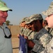 Gov. Sonny Perdue, of Georgia, shakes hands with military members from the Army and Air Force during his tour Nov. 11. The governors of Georgia, Mississippi, Wyoming and Oregon toured various bases throughout the area of responsibility on Veterans Day, sh