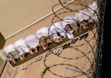 JTF Guantanamo Detainees Bow During Morning Prayer