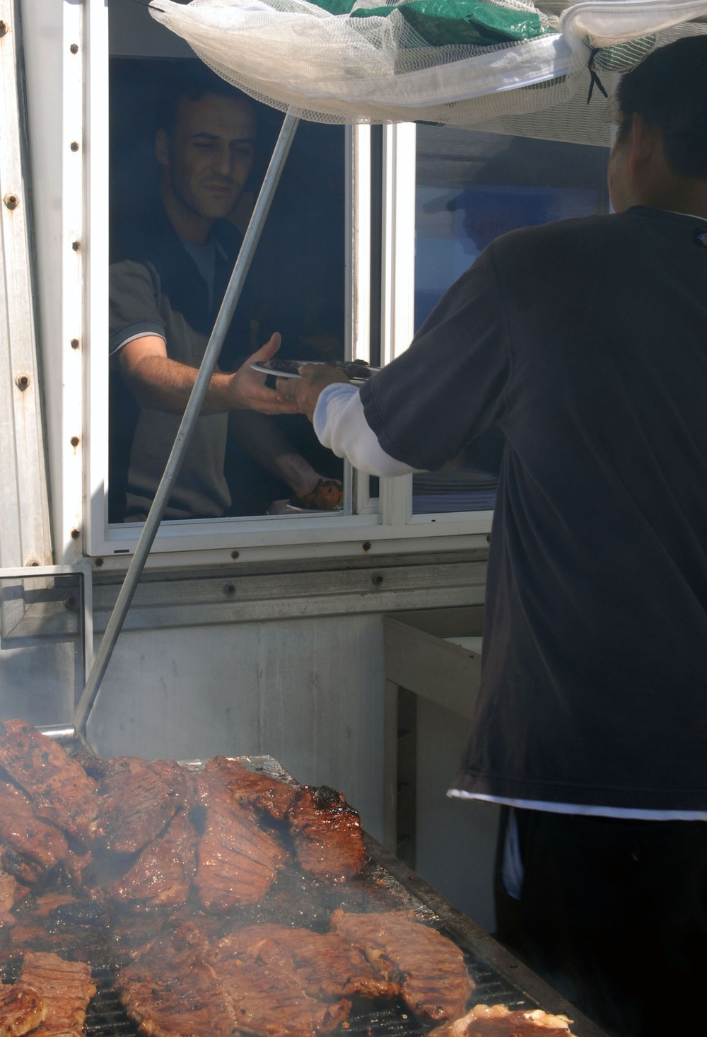 Service members are recognized on Veterans Day with a special meal at the Seaside Galley at Joint Task Force Guantanamo, Nov. 11. The galley served fare such as teriyaki steak fresh from the grill, traditional sheet cake and many other delectable treats a