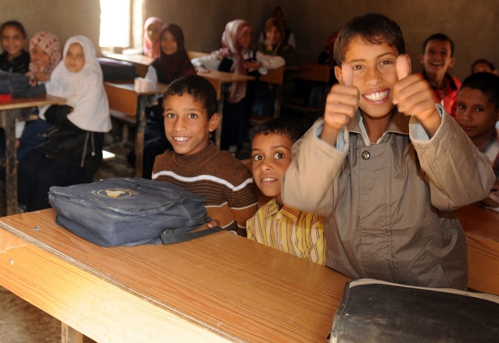 Soldiers deliver supplies, view new school building