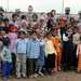 Soldiers deliver supplies, view new school building