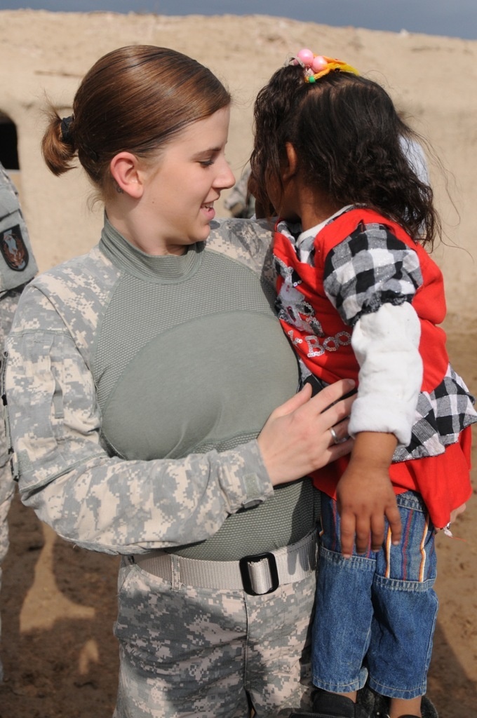 Soldiers deliver supplies, view new school building