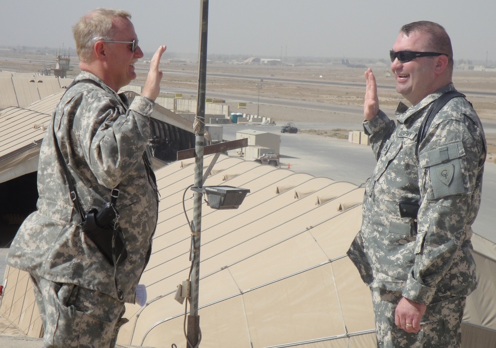 Soldiers continue long, winding road, re-enlist while in Iraq