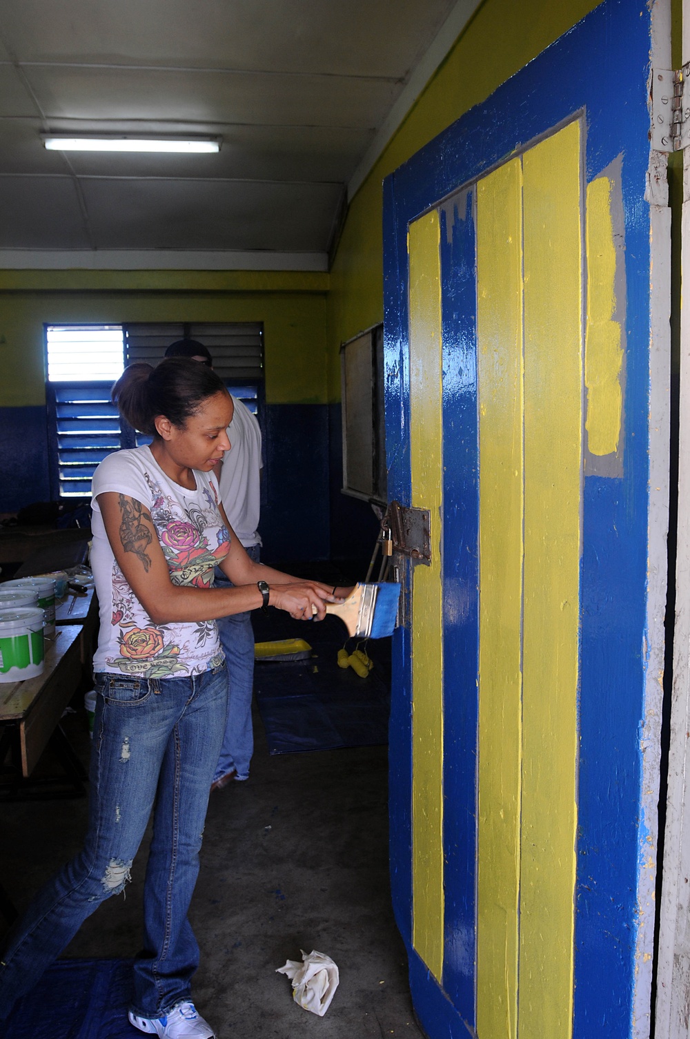 Security Cooperation Marine Air-Ground Task Force Marines and Wasp Sailors paint school in Jamaica