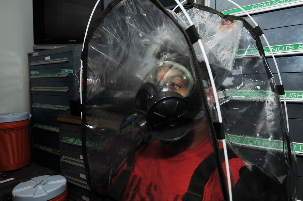 USS Nimitz personnel fitted for gas masks