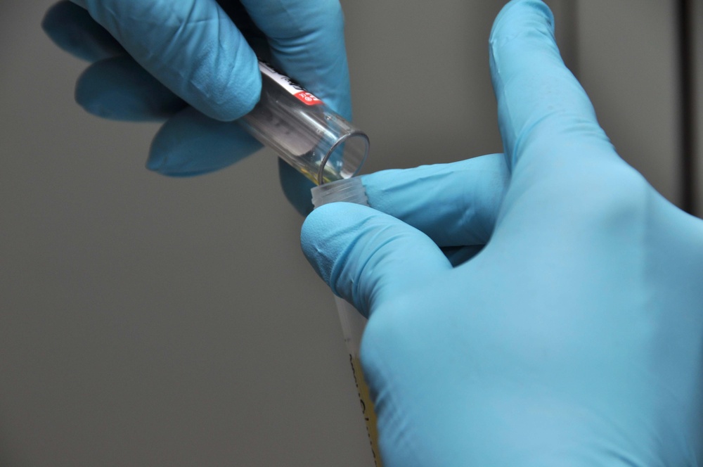 USS Nimitz hospital corpsman analyzes blood sample