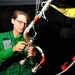 Electronics Technician spot ties wiring of EA-6B Prowler