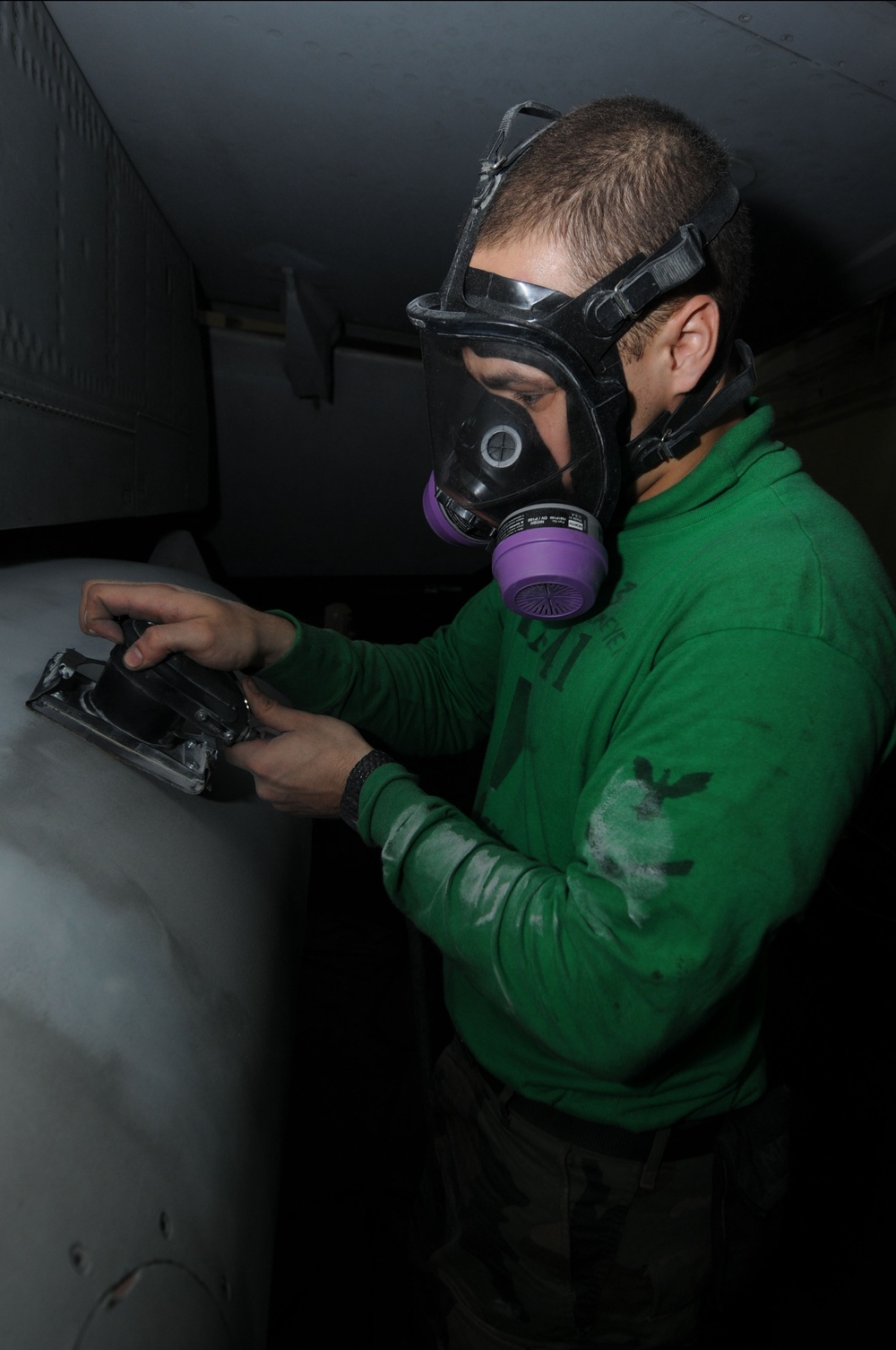 USS Nimitz personnel maintain aircraft