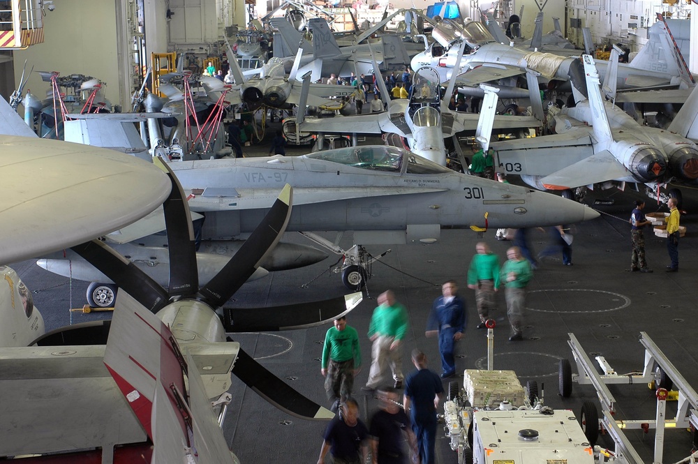 USS Nimitz personnel conduct hangar bay operations