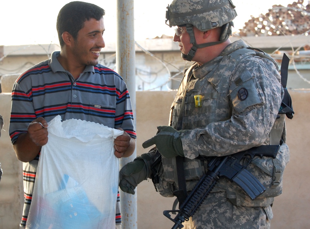 Iraqi orphans receive food for the holidays