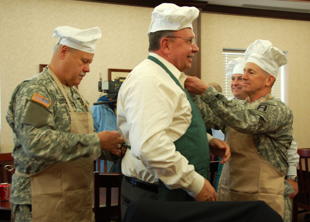 Preparing to serve a holiday meal to Soldiers