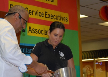Guest Chef Andre Halson Checks the Temperature of a Hot Plate During a Food Demonstration at Naval Station Guantanamo Bay