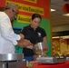 Guest Chef Andre Halson Checks the Temperature of a Hot Plate During a Food Demonstration at Naval Station Guantanamo Bay