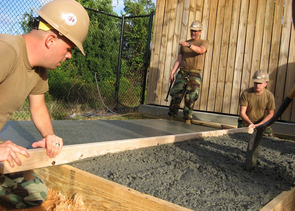 Seabees construct a tool shed at Feed My Sheep soup kitchen