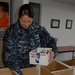 Sailors work with Adopt-a-Soldier