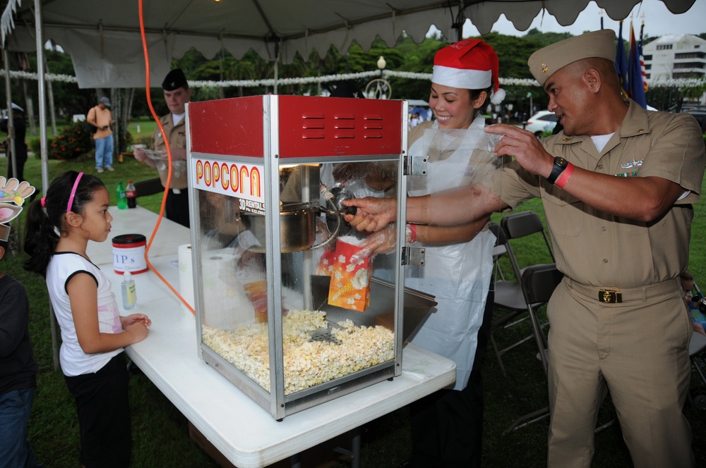 Sailors participate in Guam Chamber of Commerce's 17th Annual Christmas Festival