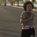 Chief Warrant Officer 2 Olga Elliot keeps a good distance in front of other racers during the 5 kilometer Veteran's of Foreign Wars Veterans Day Run Nov. 8, at Camp Victory in Baghdad. Elliott was the top female runner in the race, sprinting past the fini