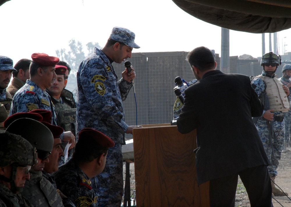Iraqi police march for review