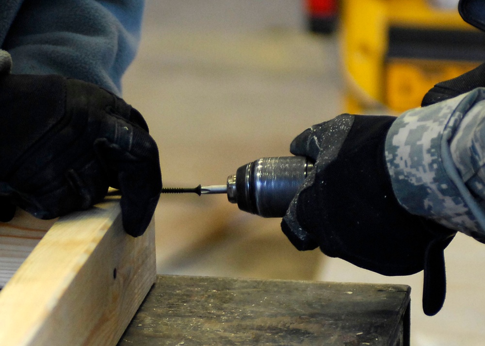 Airmen building shelves