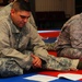 Soldier Studies Material During Combatives Course