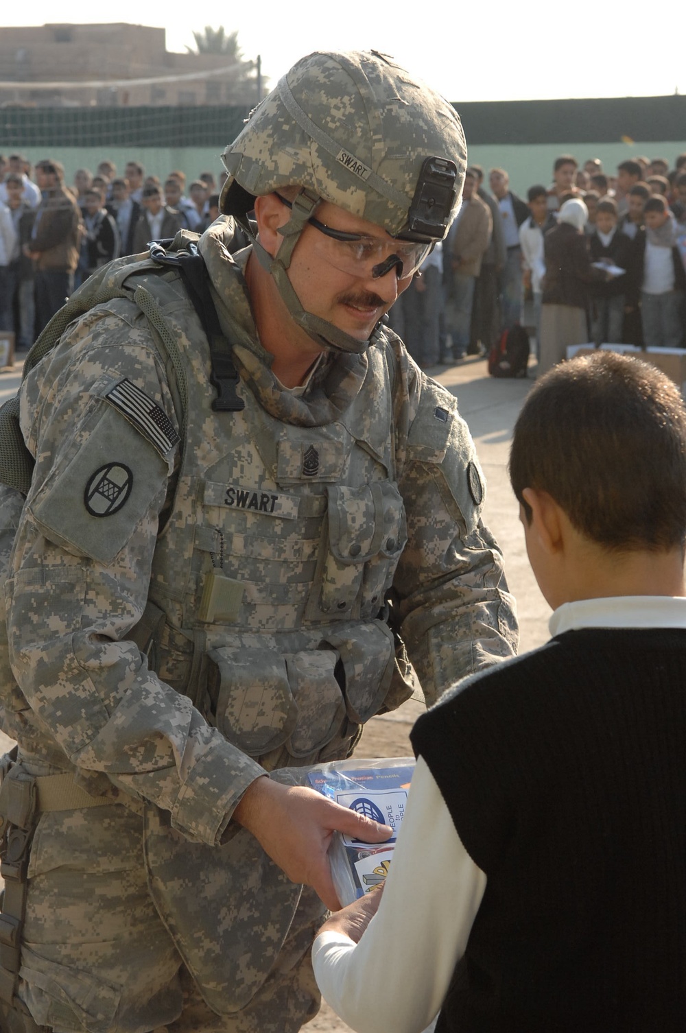 U.S., Iraqi forces deliver school supplies