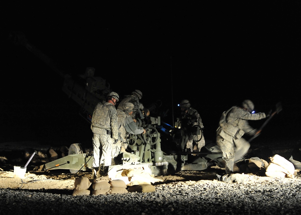 FOB Ramrod troops emplace and fire M-777 105 mm howitzer