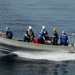 Sailors conduct operations in a rigid hull inflatable boat