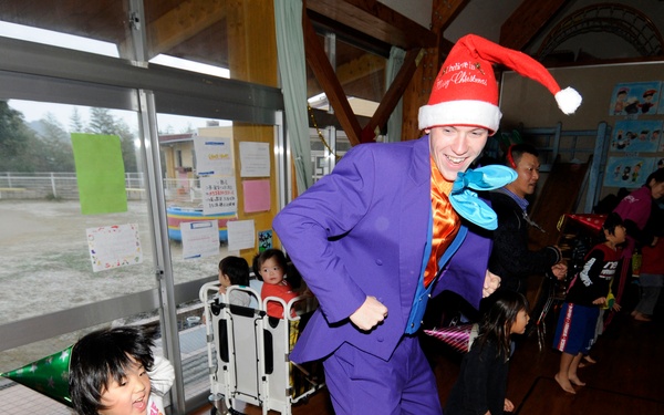 Sailors play with children