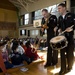 Sailors play music for children