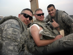 Medic treats himself after being shot by sniper