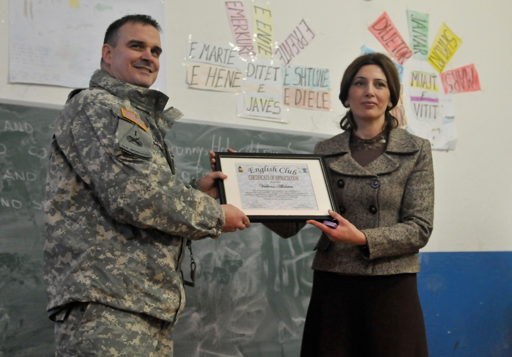 Proud California Guardsmen watch their English Club students graduate in Kosovo