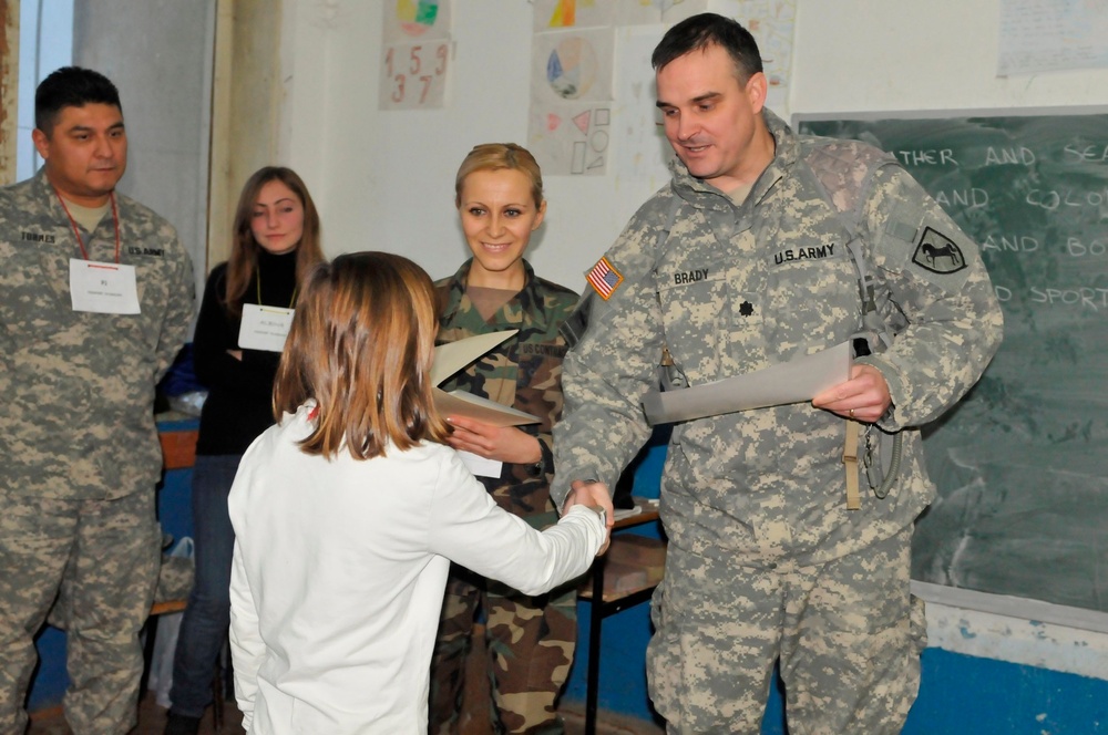 Proud California Guardsmen watch their English Club students graduate in Kosovo