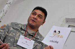 Proud California Guardsmen watch their English Club students graduate in Kosovo