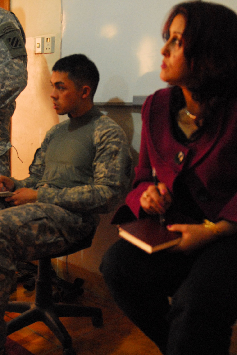 Iraqi police, Pena Women's Cultural Center, and U.S. forces discuss ways to deal with domestic violence