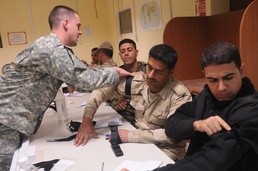 Provider medics teach Iraqi officers combat medicine