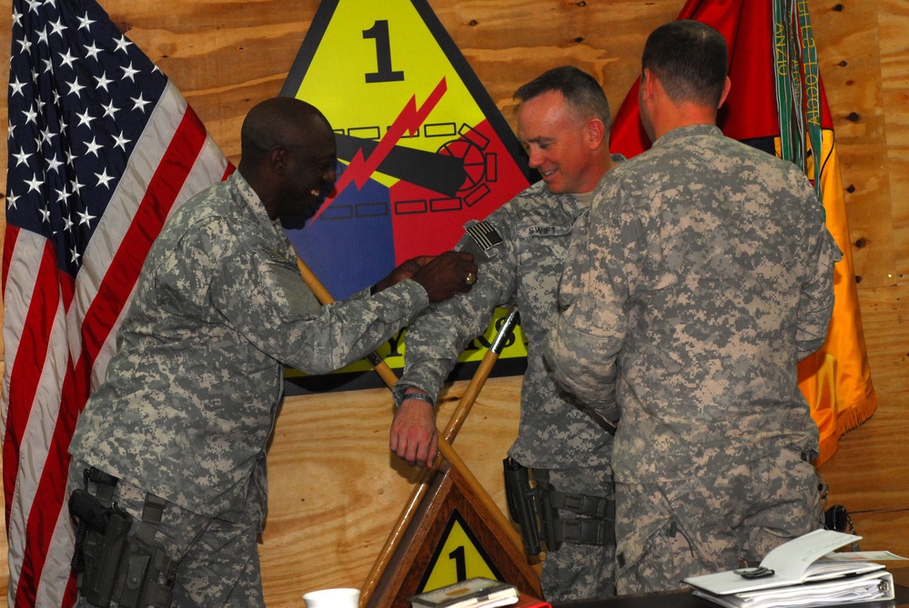 Ready First commander and command sergeant major receive Combat Patch