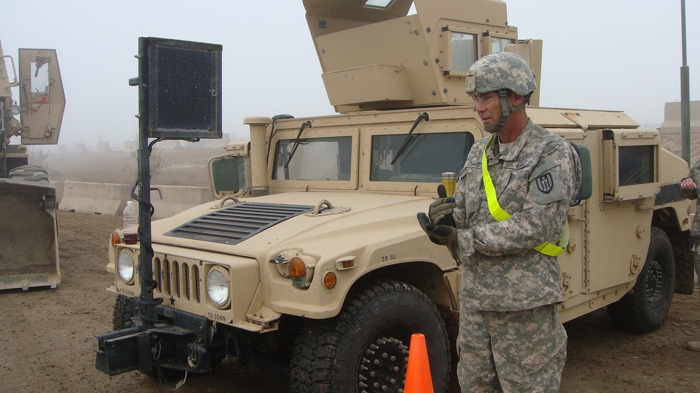 317th Engineers work to keep parking lot mud free