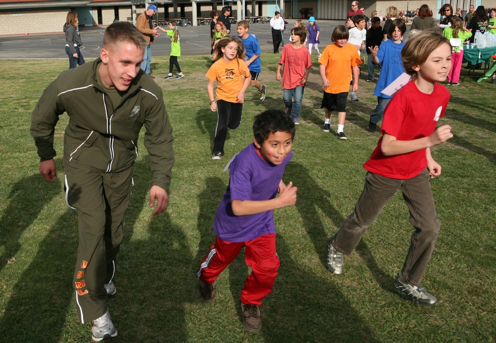 Spending Time With Students: Marines Participate in School's Annual Jog-a-Thon
