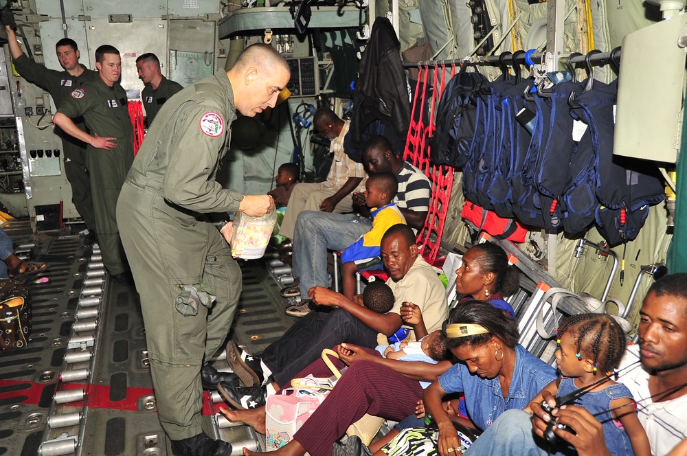 Coast Guard C-130 Evacuates U.S. Citizens From Haiti